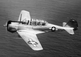 CurtissSNC-1FalcontrainerBuNo6421fromFleetAirWing11inflightnearSanJuanPuertoRicoin1943ThepilotwasLTjgWEEdwardswithAP1cCuppelinthebacksea.thumb.webp.5ca80ee5d2aba302e39058a0efe51e3a.webp